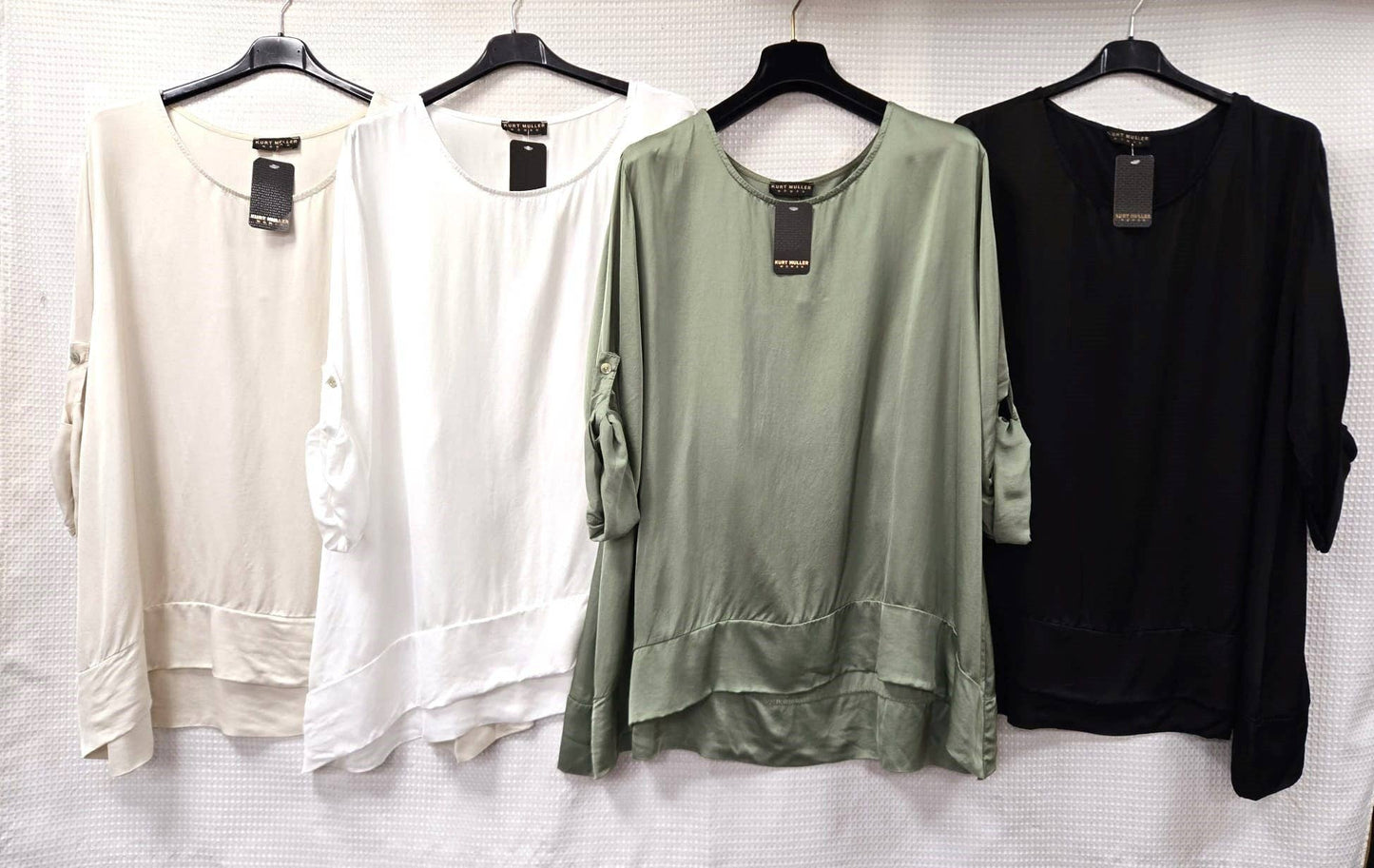CREW NECK DIPPED HEM SATEEN TOP
