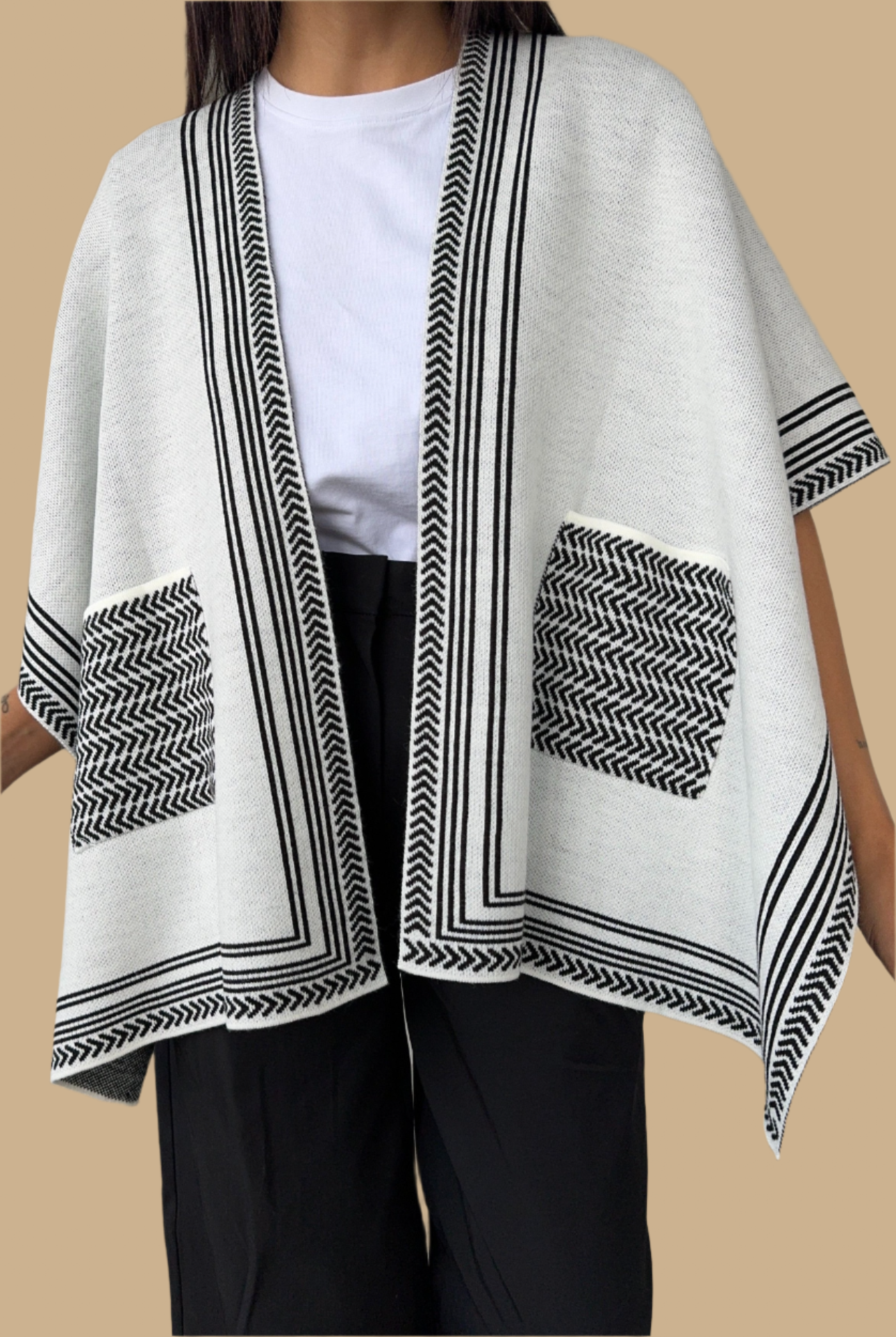 Knitted Cardigan/Poncho with stripe edge.