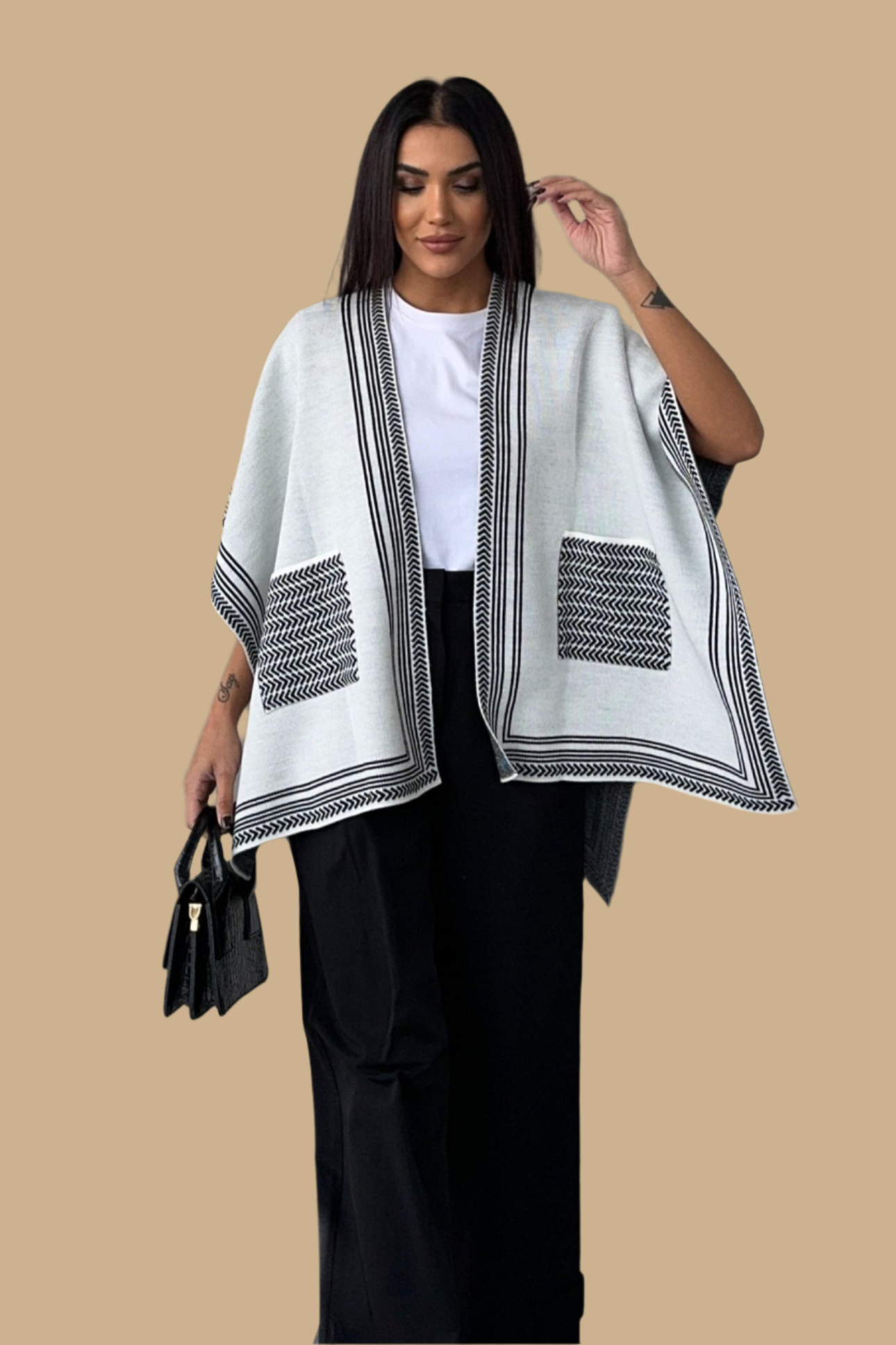 Knitted Cardigan/Poncho with stripe edge.