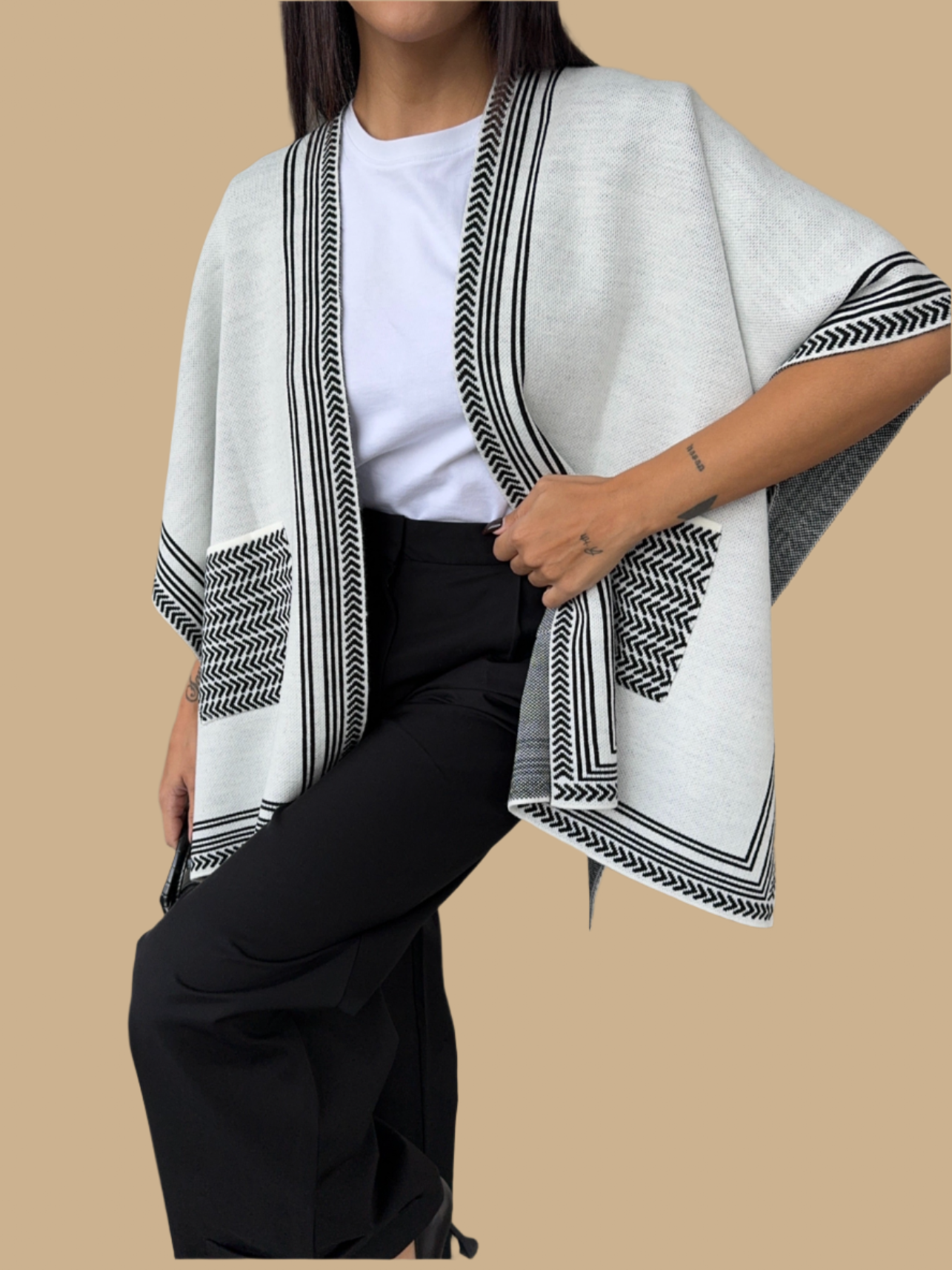 Knitted Cardigan/Poncho with stripe edge.